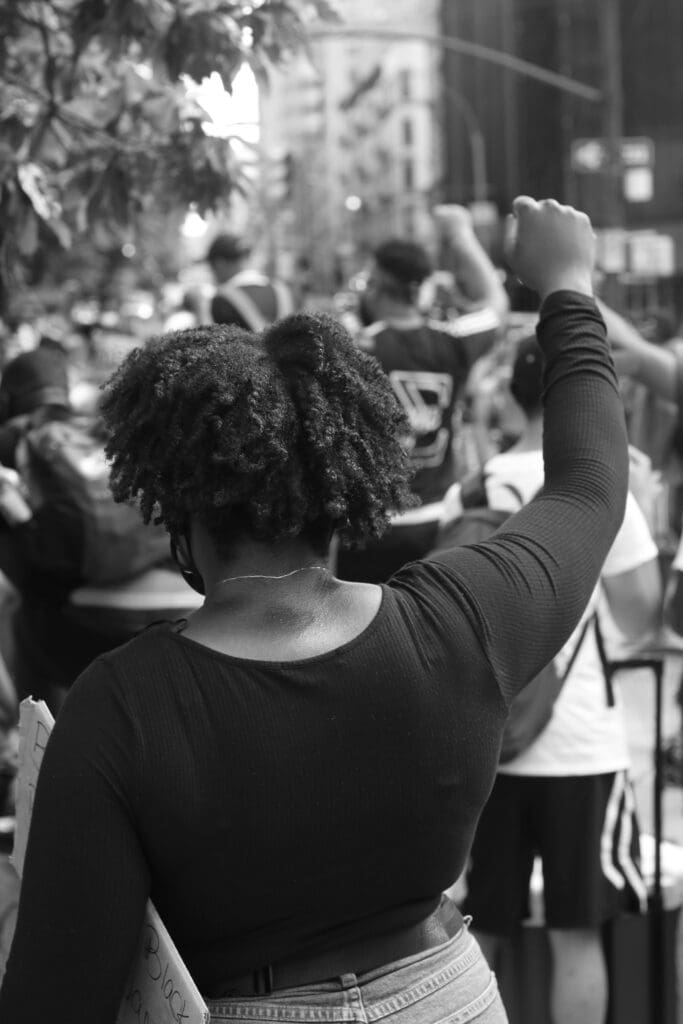 Black protester marching.