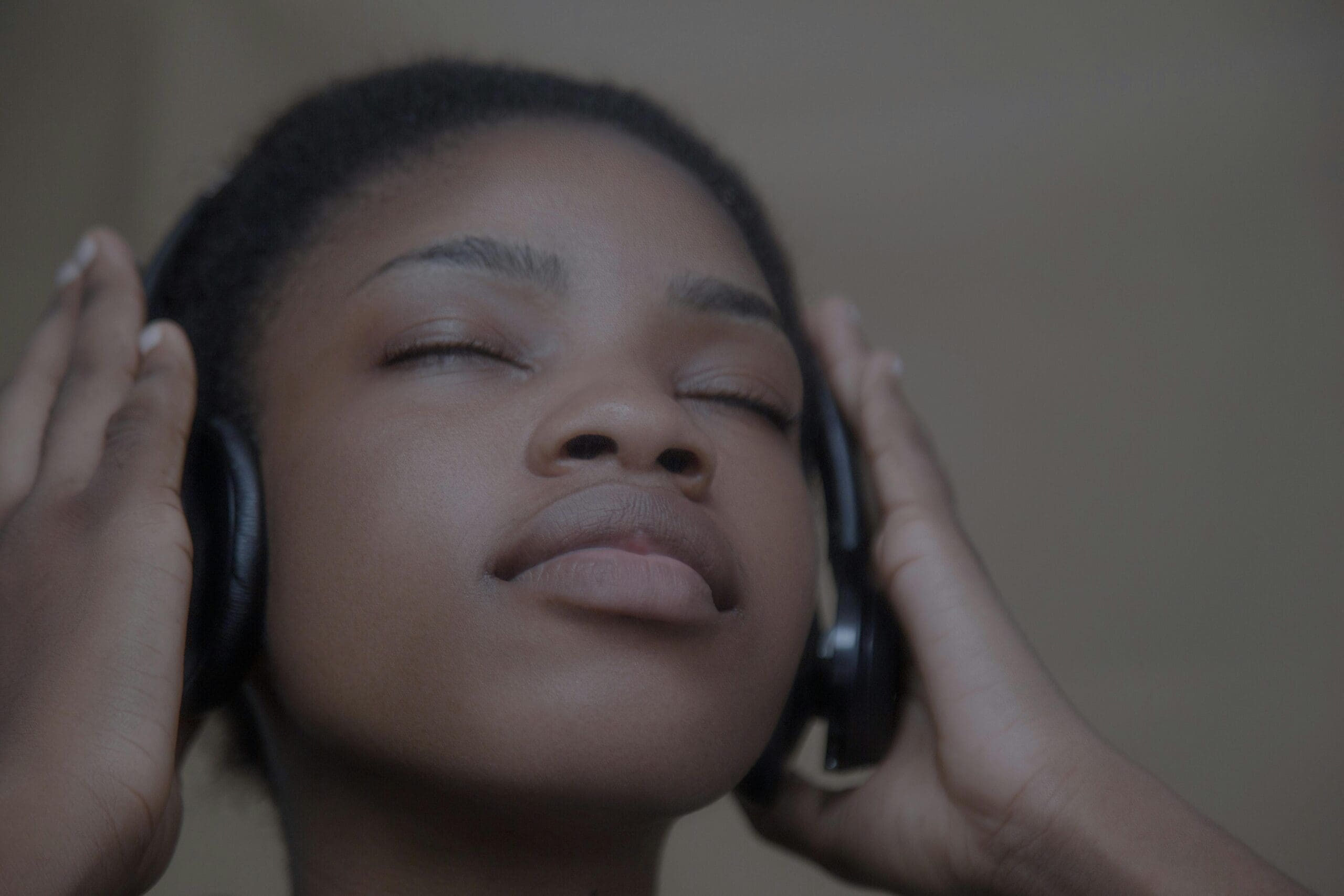 Black woman in headphones doing EMDR therapy in Pennsylvania.